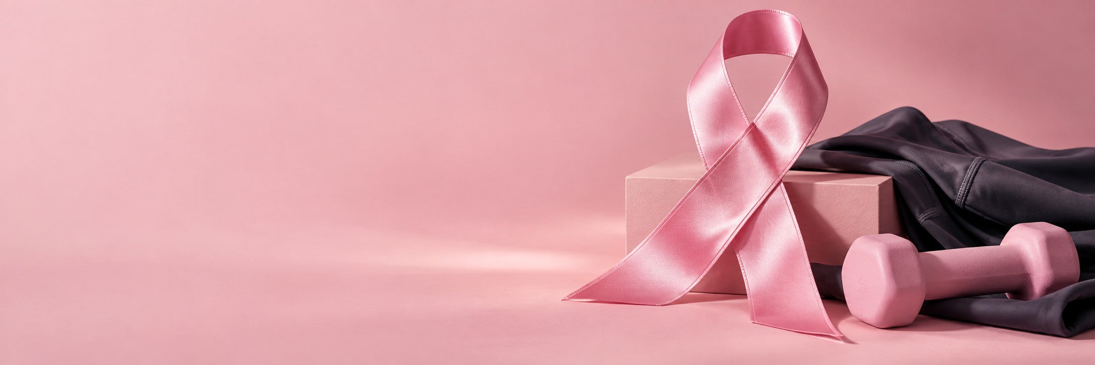 Pink awareness ribbon with athletic fabric and a pink dumbbell